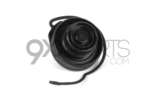 cap with retaining strap for
fuel tank